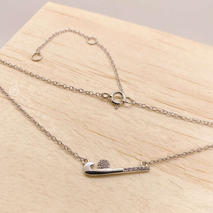 Dainty .925 Sterling Silver Field Hockey Necklace with premium cubic zirconias in a pavé setting.