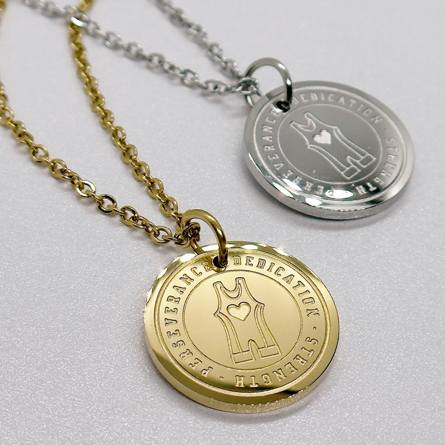 Wrestling disc charm necklaces in gold and silver.