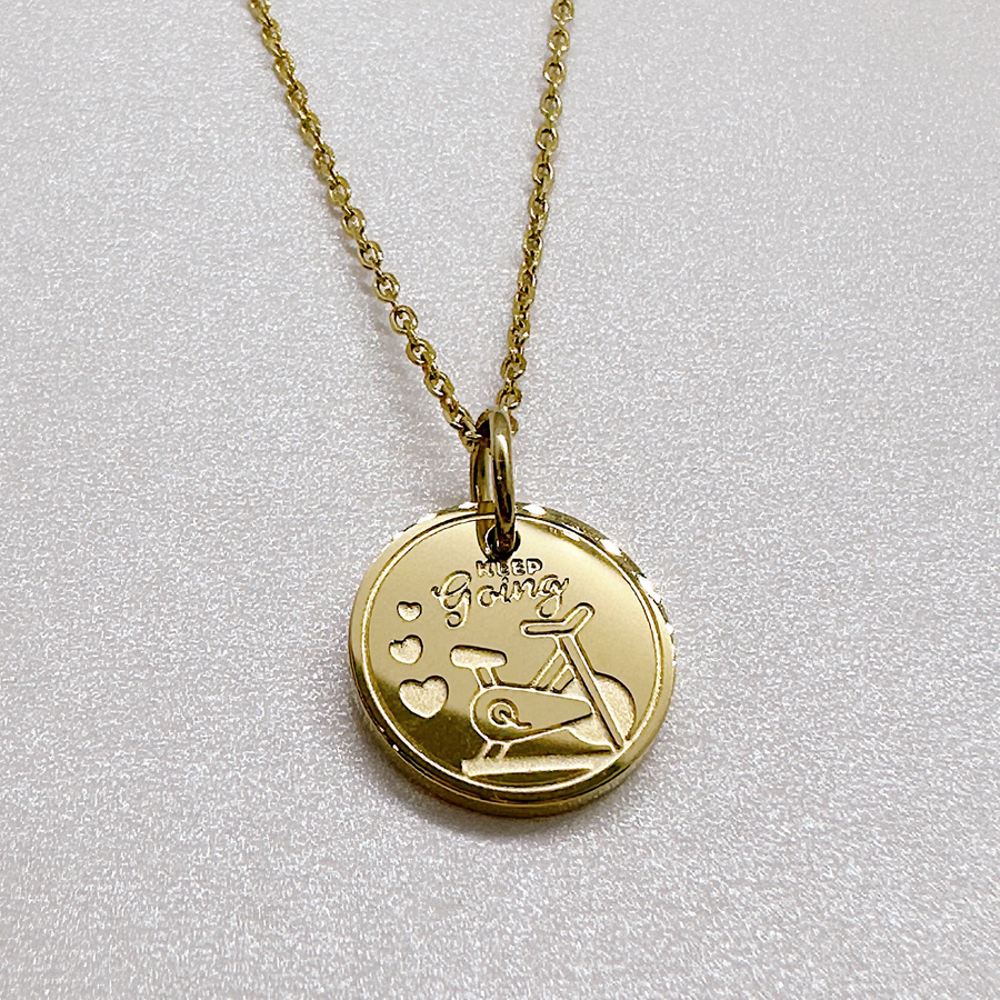 Gold indoor cycle fitness disc charm necklace.