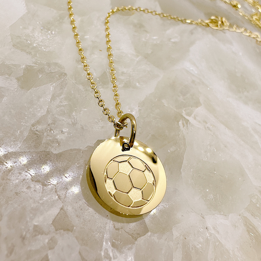 Gold soccer disc charm necklace.
