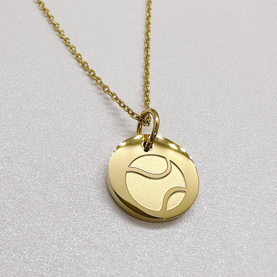 Gold tennis disc charm necklace.