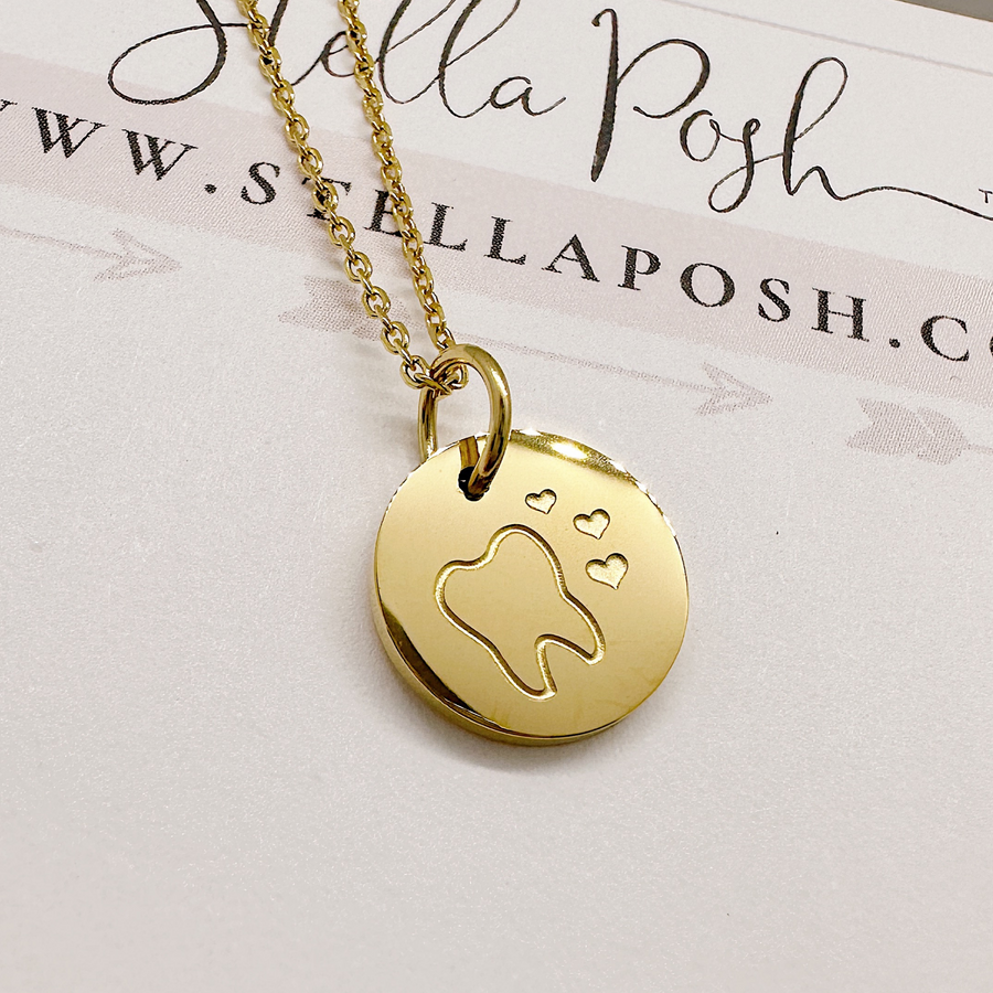 Gold Tooth disc charm necklace.