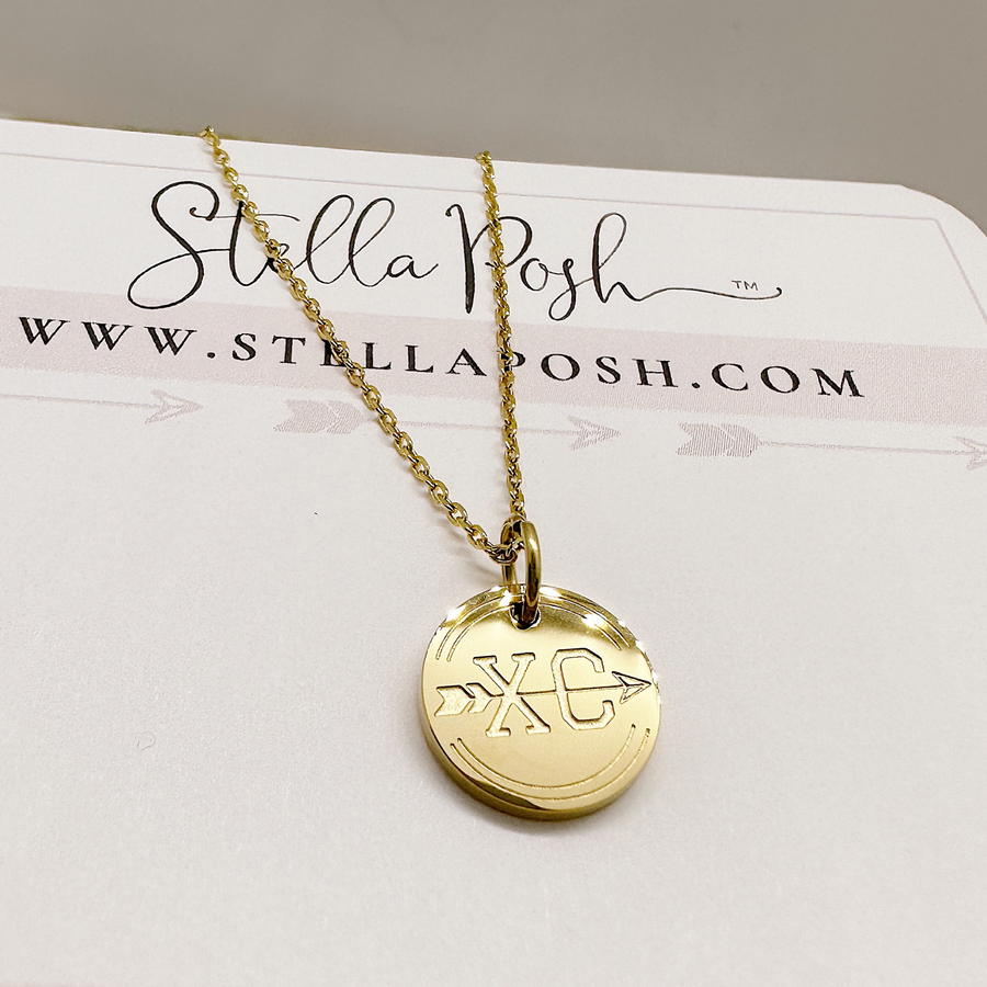 Gold cross country disc charm necklace.