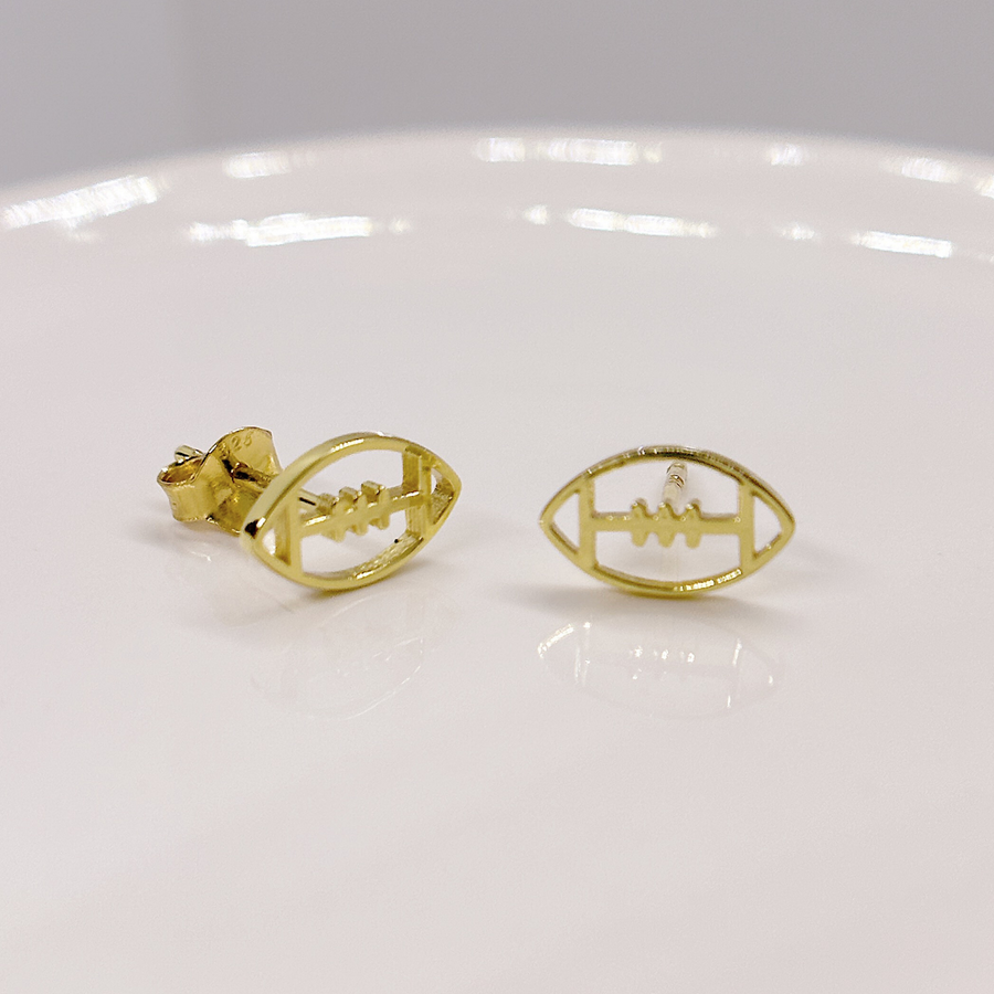 Tiny Football earrings in gold.