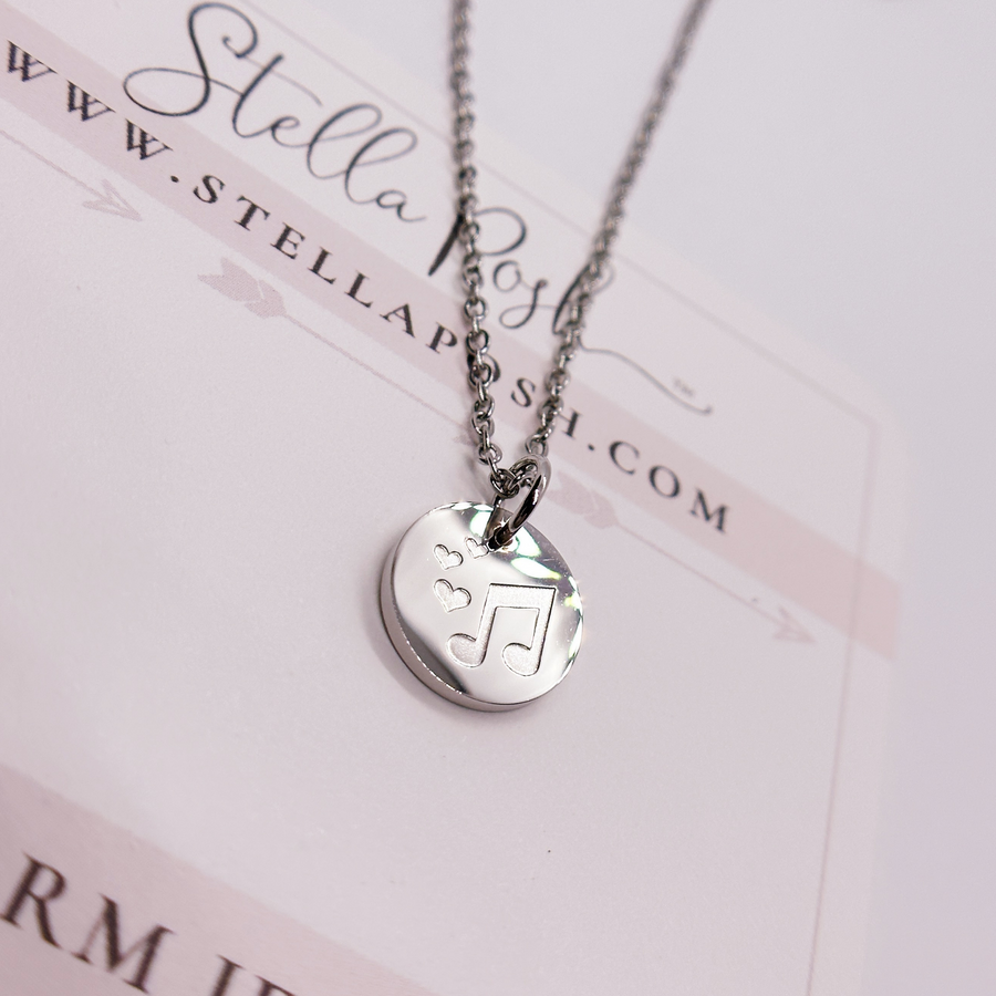 Silver music note musician disc charm necklace.
