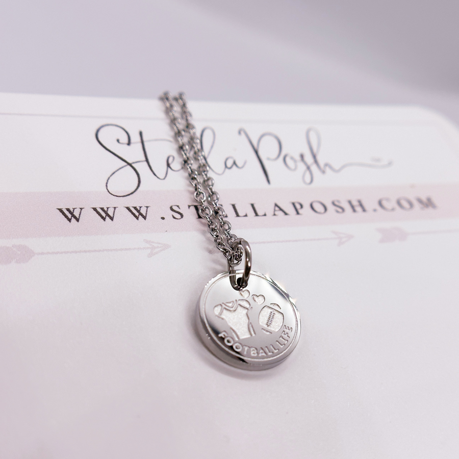 Silver football disc charm necklace.