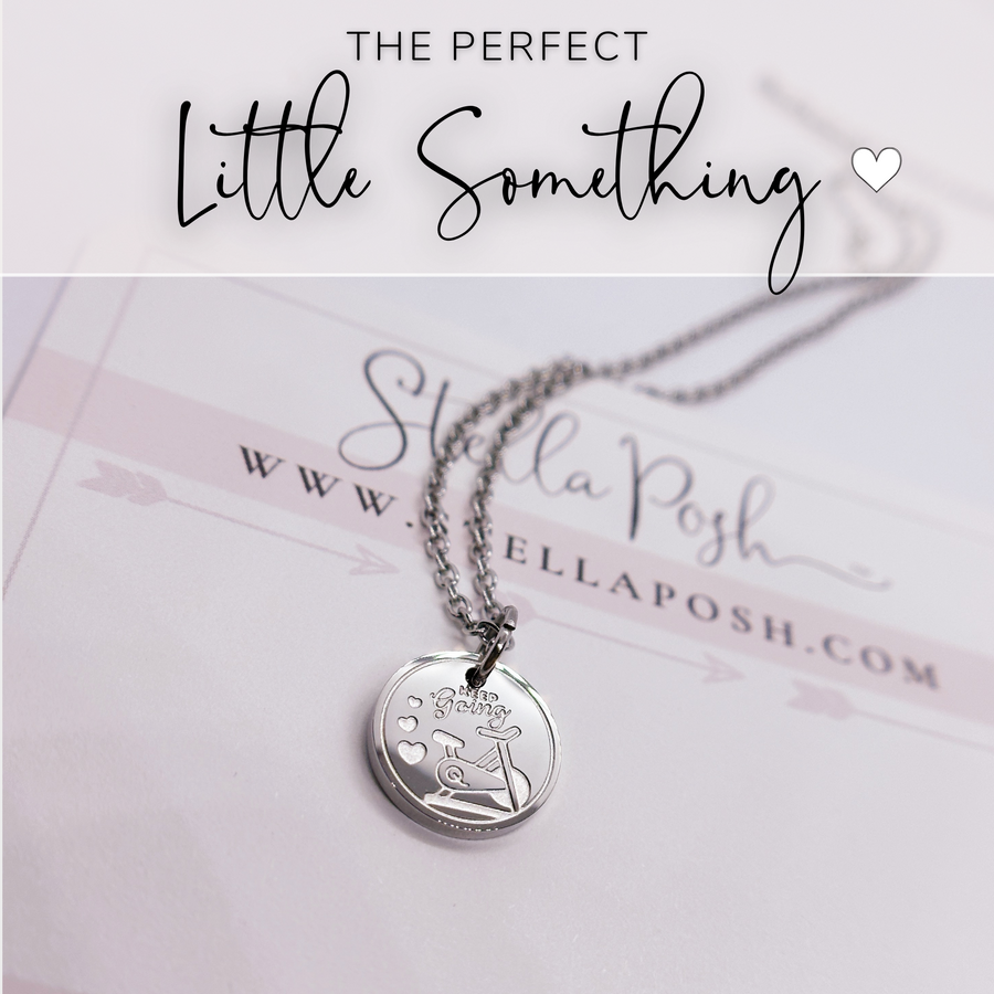 That perfect little something. indoor cycle fitness disc charm necklace.
