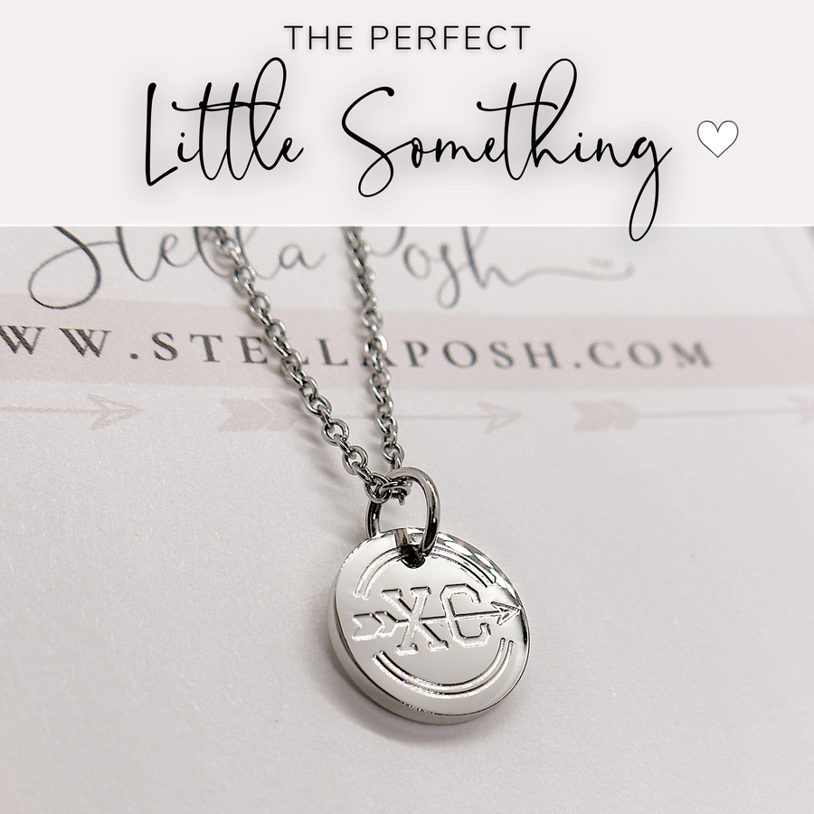 That perfect little something, cross country disc charm necklace.
