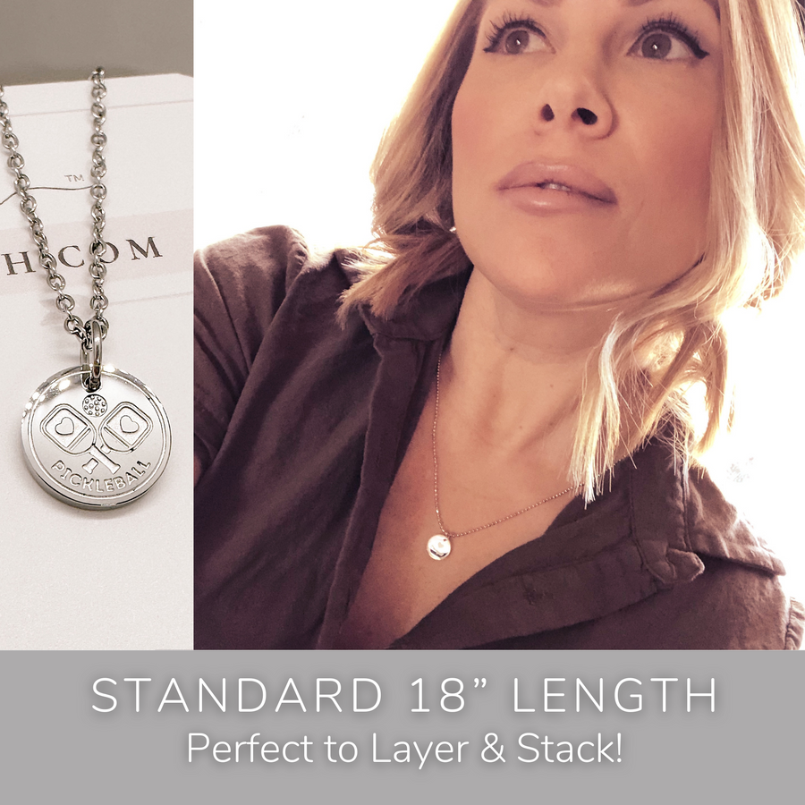 Model wearing stackable disc charm necklace. Perfect to Layer and Stack!