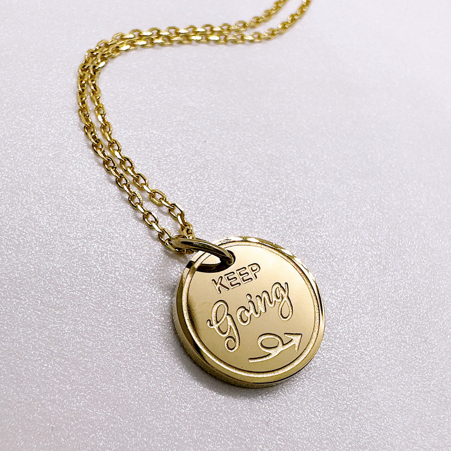 Gold keep going variation for graduation disc charm necklace.