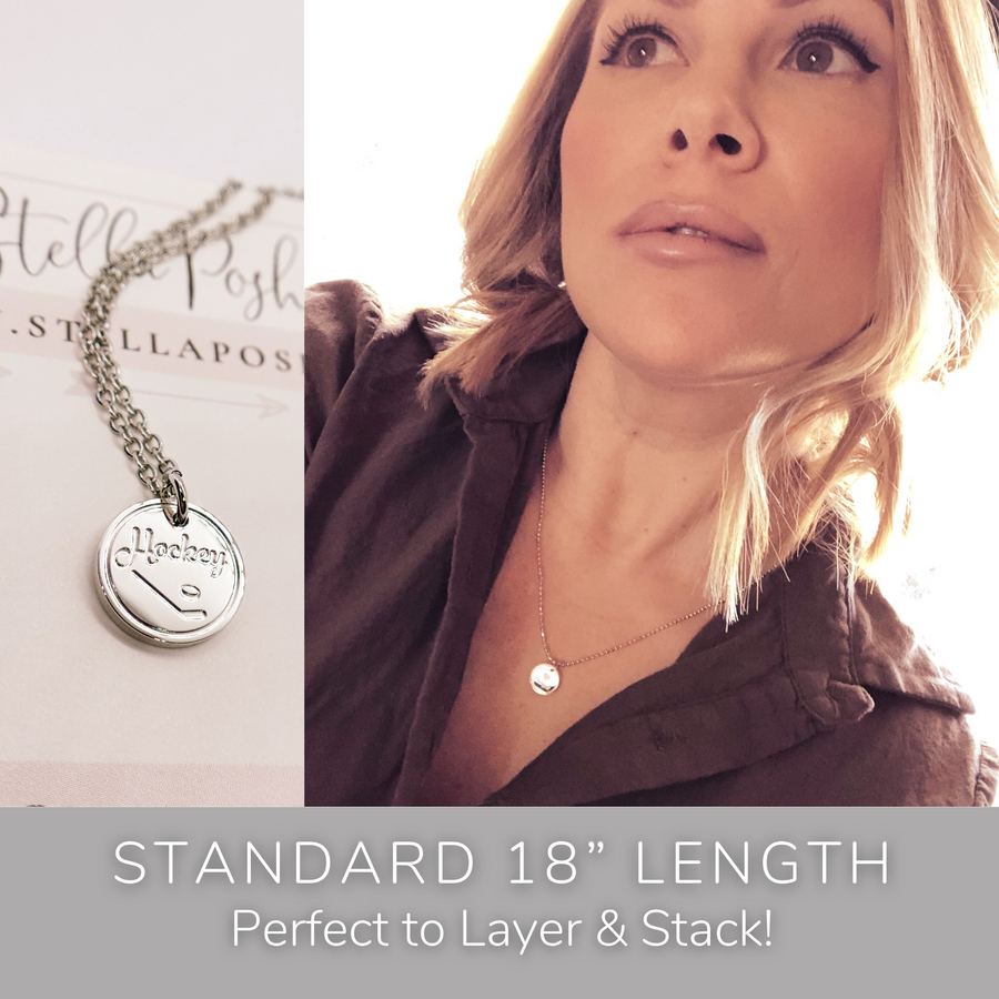 Model wearing stackable disk charm necklace.