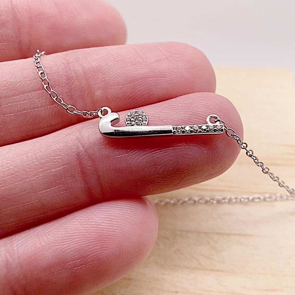 Video of Dainty .925 Sterling Silver Field Hockey Necklace with premium cubic zirconias in a pavé setting.