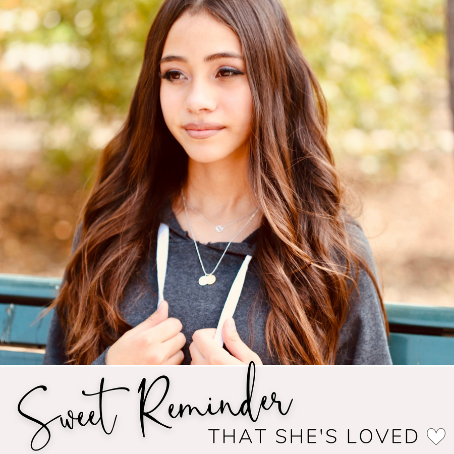 Brunette Teen Model wearing Dainty Golf Necklace with Golf charm, and 'She believed she could so she did' charm, layered with .925 silver necklace, a sweet reminder that she's loved.