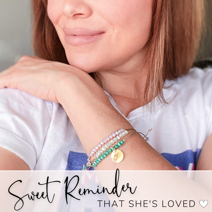 Model wearing string bracelet set; a Sweet Reminder that she's loved.