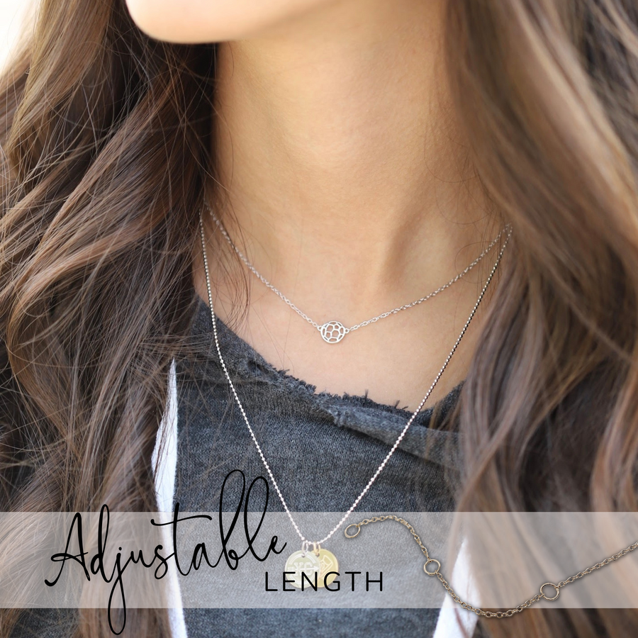 Teen Model wearing adjustable Tiny .925 silver Soccer Necklace, layered with a Charm Necklace.